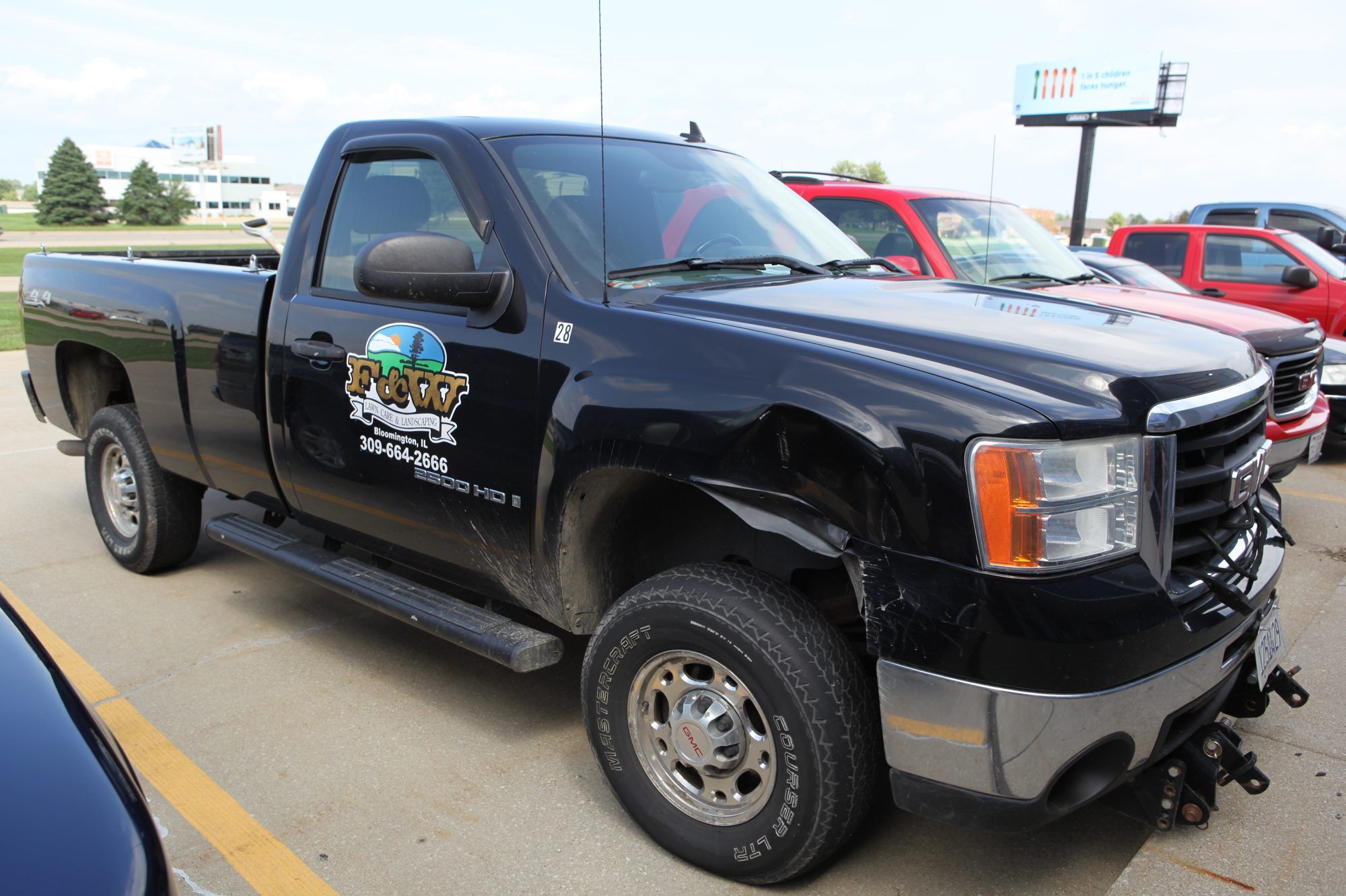 F&W Lawn Care & Landscaping pickup truck with company logo