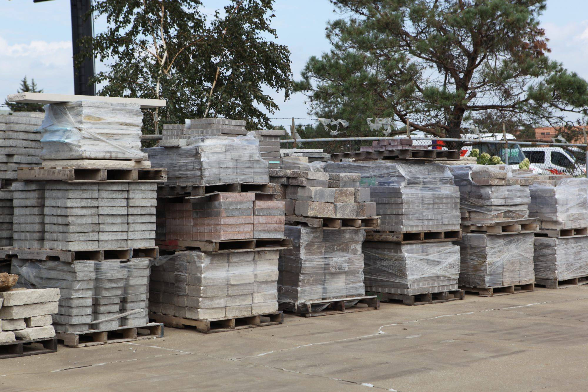 Pallets of pavers and wall block stacked in the F&W material yard